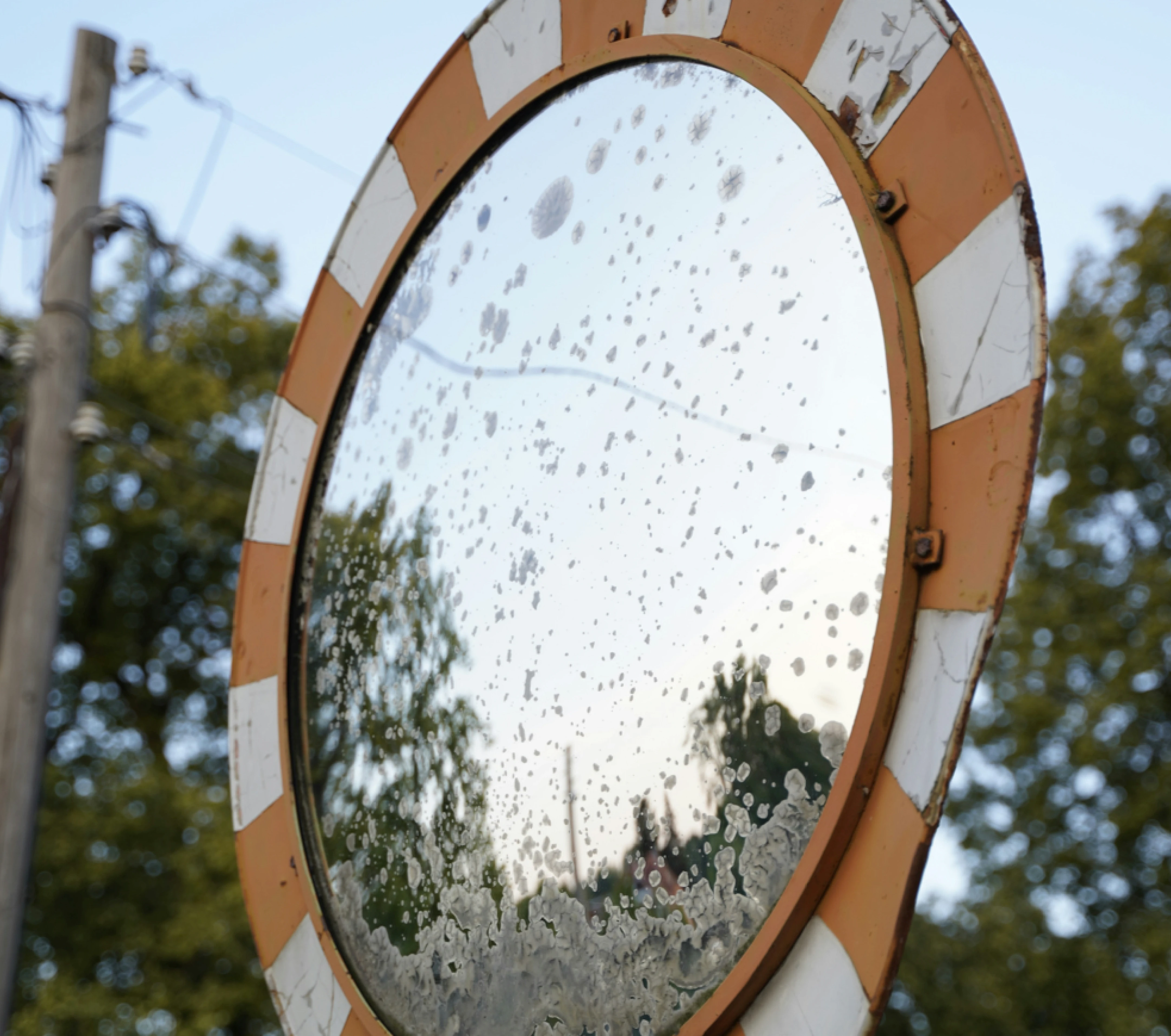 A wide-angle mirror assists bus drivers and others on the road with visibility around tight turns on narrow roads.